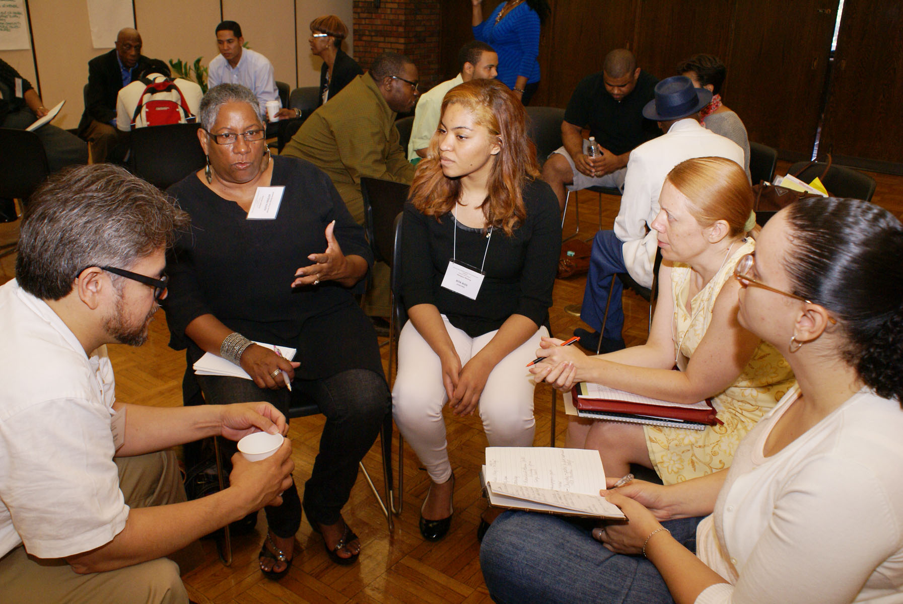 Community members exchanging ideas in a facilitated organizing circle