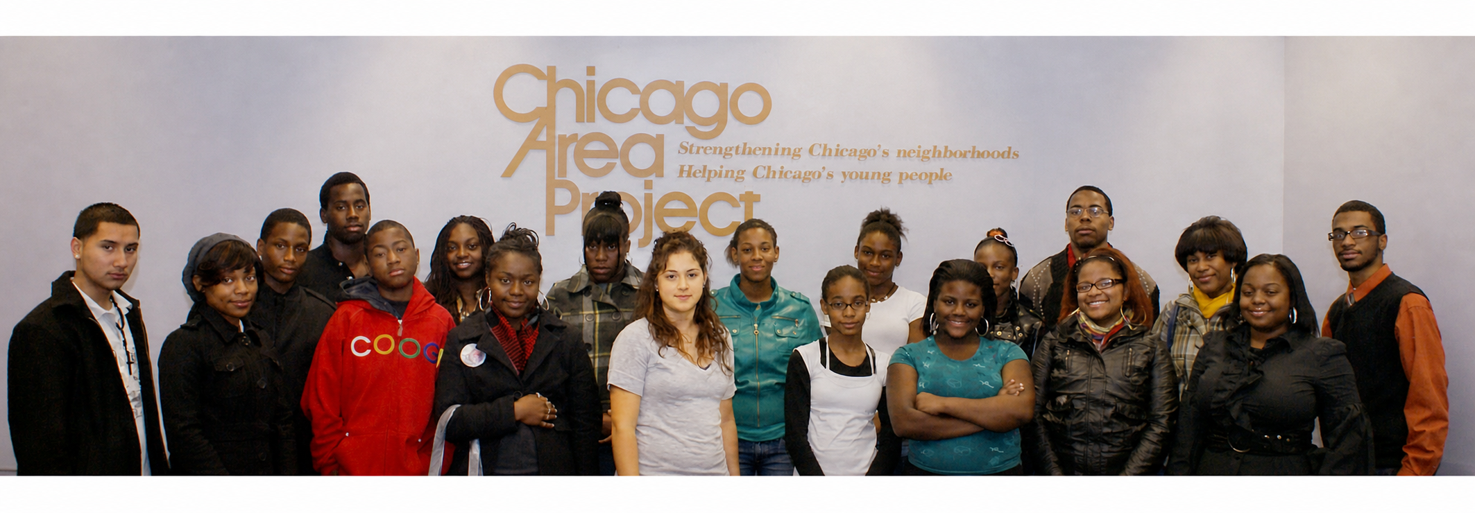 Chicago Area Project youth ambassadors gathered beneath the CAP name