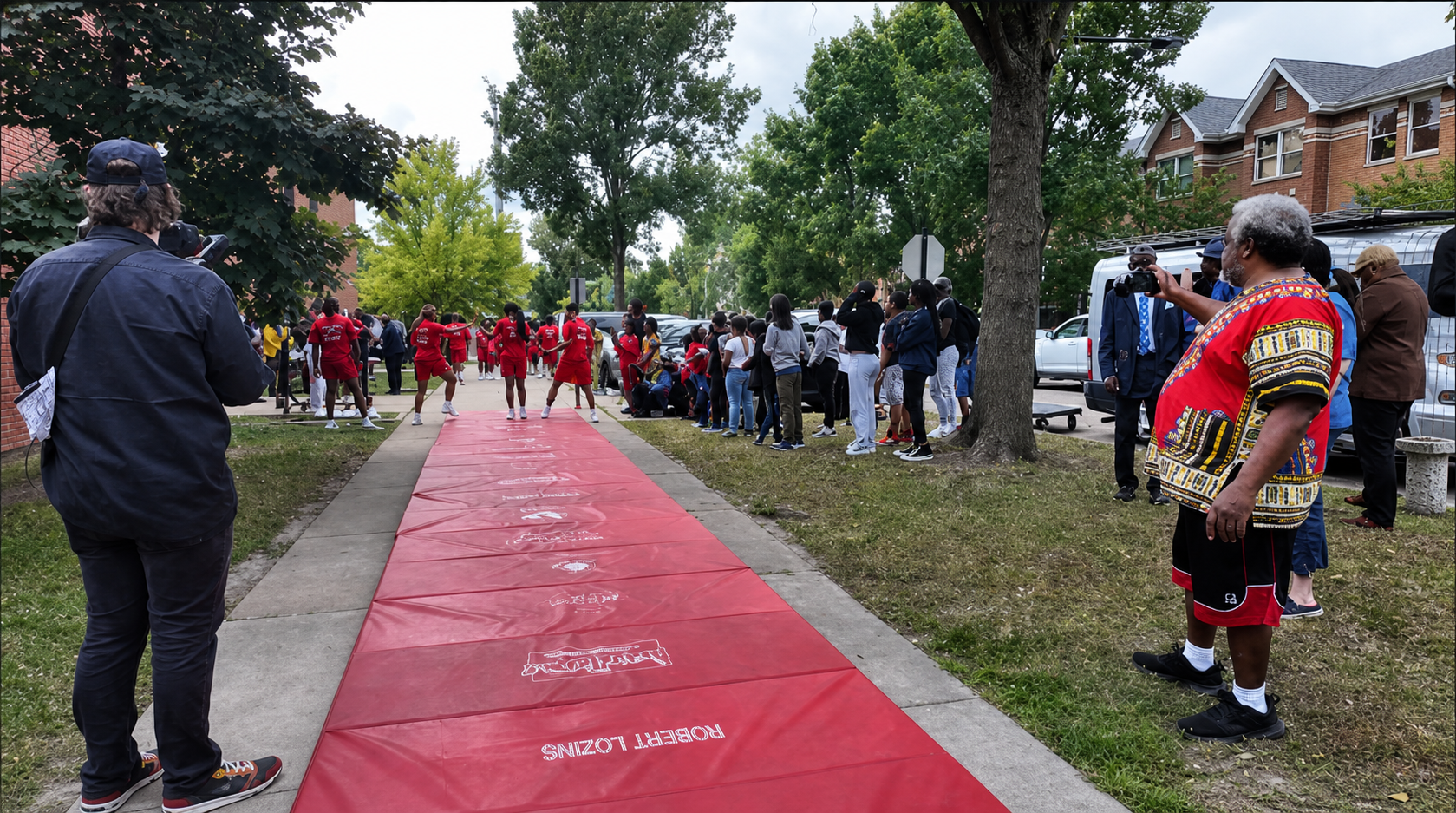 Neighbors gathered along a community peace route